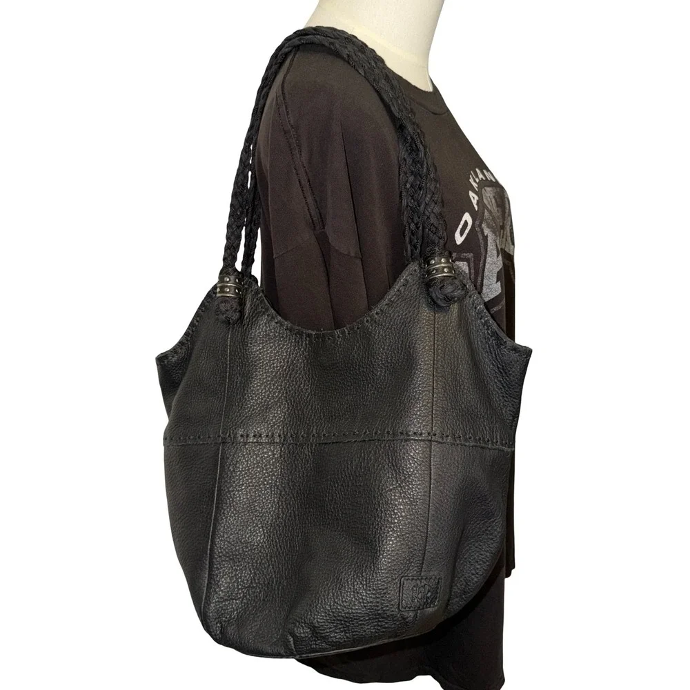 The Sak Indio black leather hobo bag, braided shoulder straps